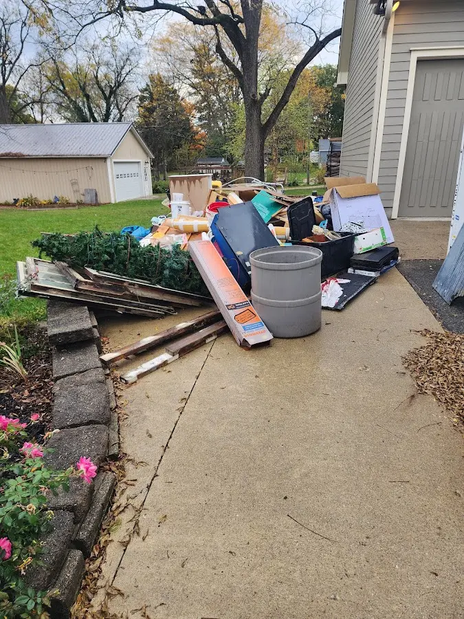 Dumpster being loaded with debris for Roofing Dumpster Rental in Roebuck